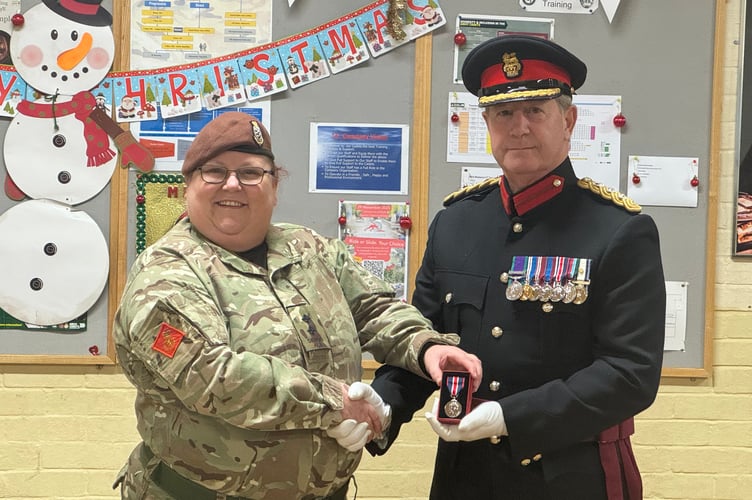 A long service award was also presented by Mr John Cummings, Deputy Lieutenant.  AQ 9541
