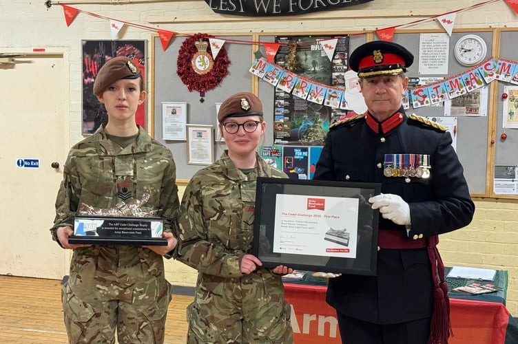 Cadets with the award which was presented by Mr John Cummings, Deputy Lieutenant.  AQ 9532
