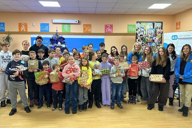 Charity barber event raises funds, collects toys for Ukraine children