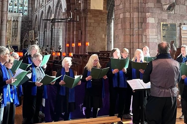 The Crediton Singers singing in Holy Cross Church.

