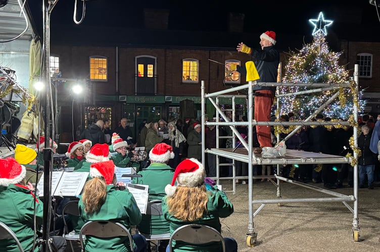 The band Musical Director Iorwerth Pugh conducted from a platform in front of the band.  AQ 1235
