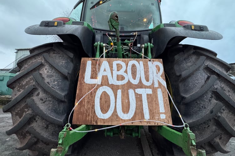 ‘Labour Out’ read one of the signs on a tractor taking part in the charity drive. AQ 0951