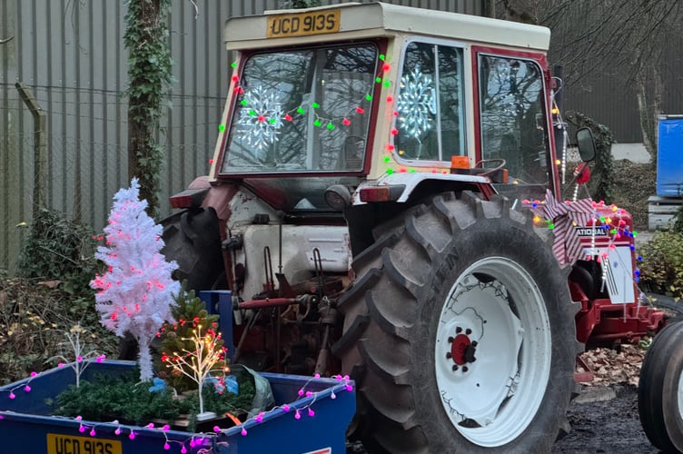 A Christmas tree and lights adorned one of the tractors taking part in the charity run. AQ 0952