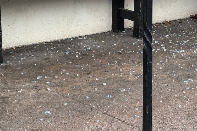 Glass across the floor in the Union Road bus stop.  AQ 1430
