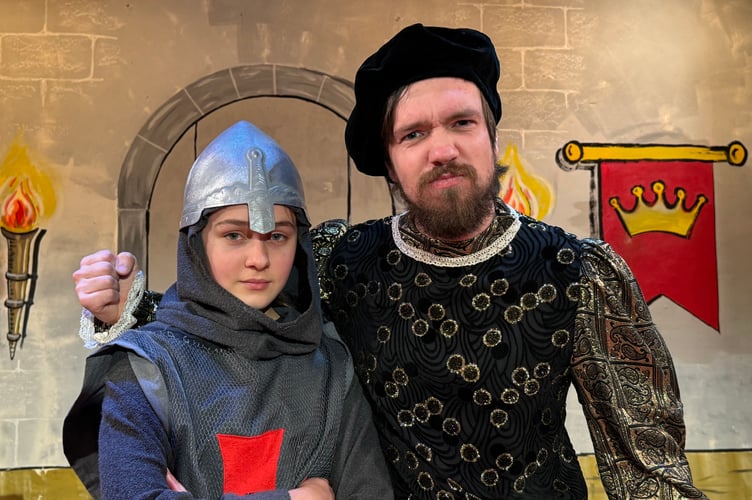 Lewis Dyson, right, plays the part of the Sheriff and is pictured with guard Caitlin Bradley (13). AQ 1670