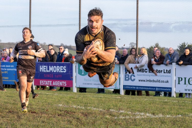 Josh Woodland going airborne to score 