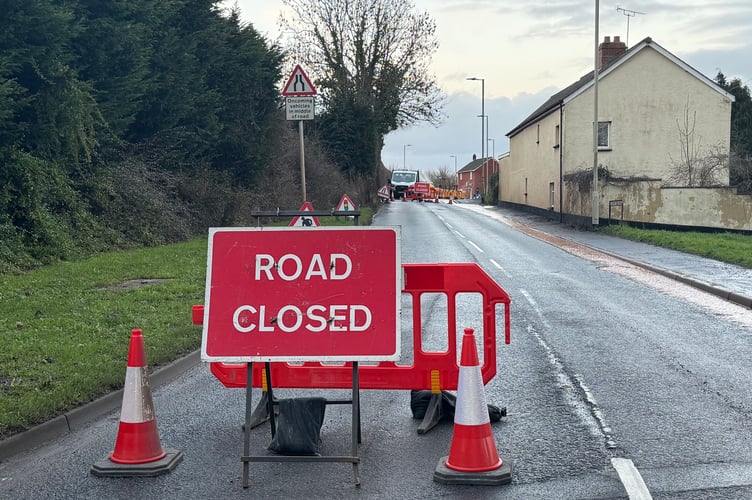Road closure signs are in place. AQ 2363