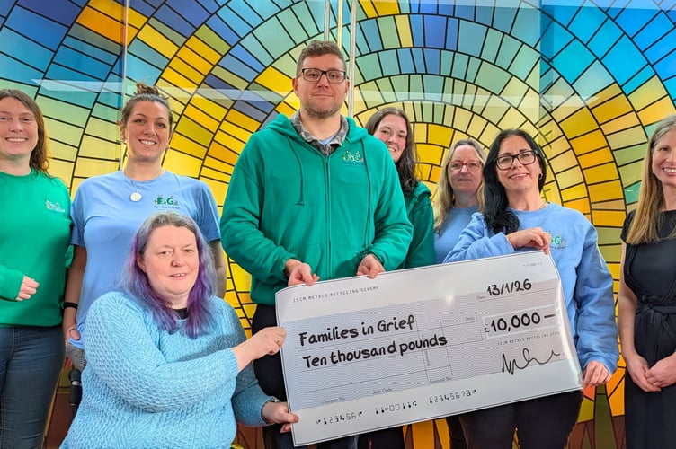 Councillor Helen Walker and North Devon Crematorium staff presenting a cheque to representatives from Families in Grief.
