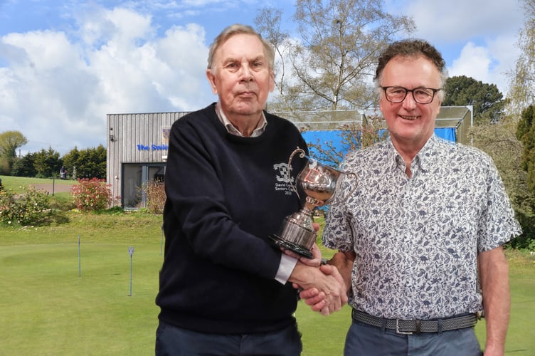Seniors Captain David Cousins presents the Senior Golfer of the Year cup to Andy Frankum.
