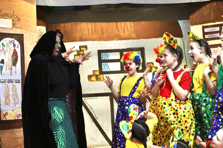 The evil Nightshade frightening the children dancers