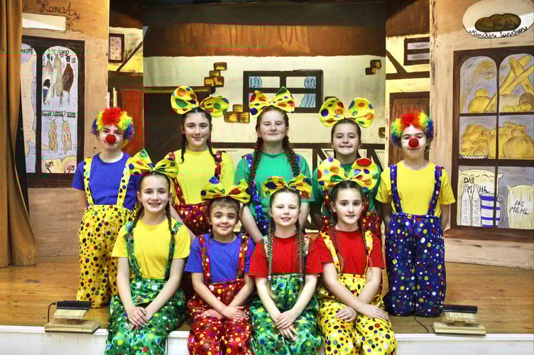 The children dancers in one of their roles as circus clowns