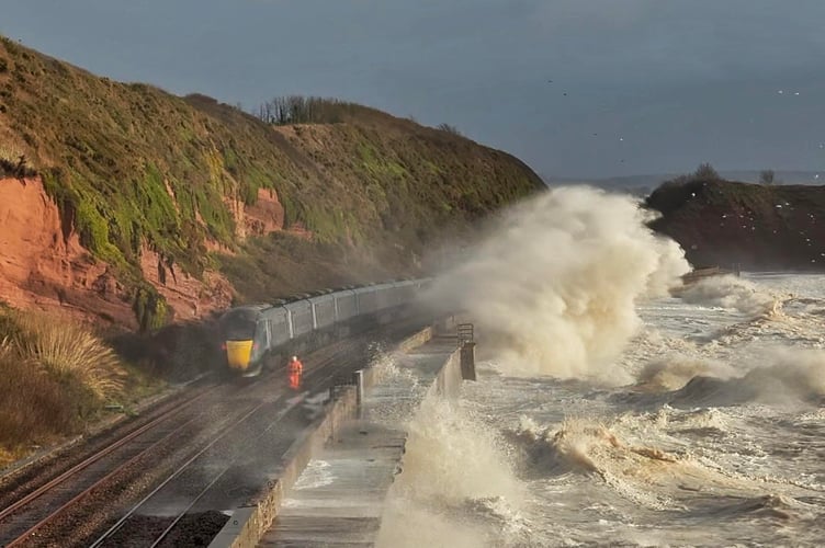 Waves battering the railway line at Dawlish. Photo Pilchard Cottage