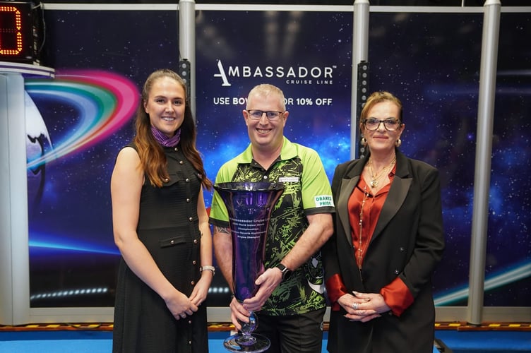 Ambassador Cruise Line 2026 World Indoor Bowls Championships open singles winner Robert Paxton flanked by Jane Potter, of Potters Resorts, and Rebecca Jones, head of brand and marketing, Potters Resorts.
