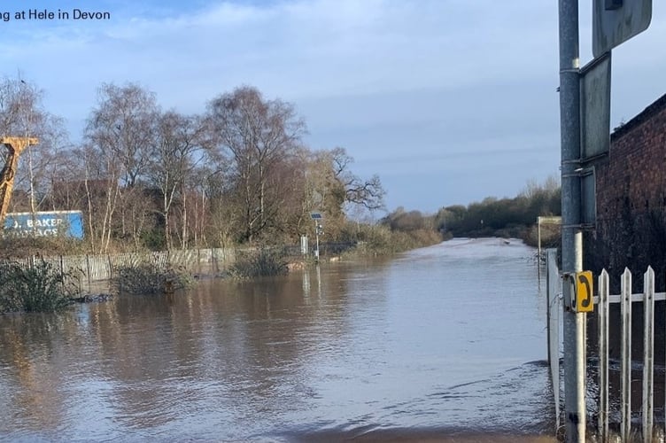 Flooding at Hele has caused issues for the rail line which is obscured by the flood.