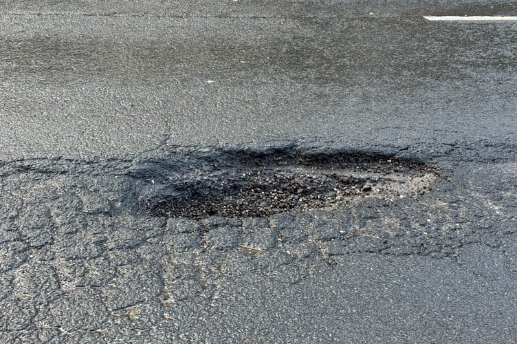 The pothole on the A377 between Downes Corner to Hookway Cross on the outskirts of Crediton before it was repaired on Thursday, January 29. AQ 3230
