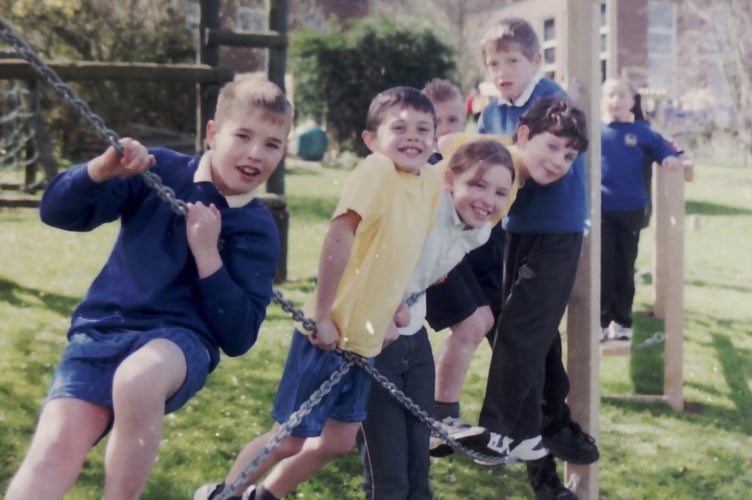 Morchard Bishop schoolchildren using new adventure play equipment in April 2004. DSC00177