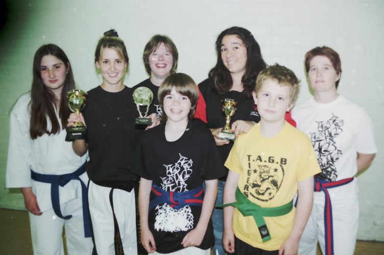Crediton martial arts expert Becky Brooks, second left, with students who competed at the Welsh Taekwondo championships in Cardiff in May 2004. DSC00622
