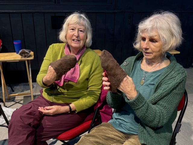 Two of the participants inspecting and sharing their feet felts!