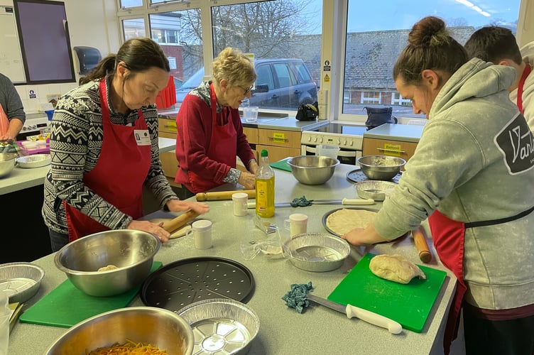 Busy making pizzas and garlic bread