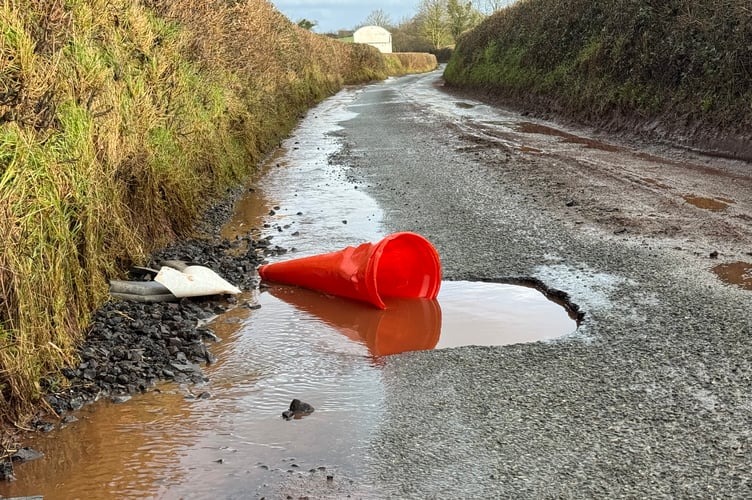 One of the potholes on the road from Crediton to Yeoford.  AQ 3943
