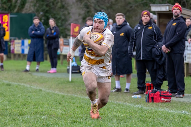 John Woodland on the way to score his try for Crediton during the Okehampton game.
