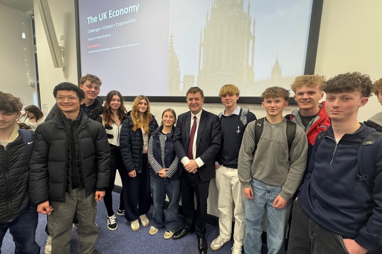 Sir Mel Stride with A level Economics students at Exeter College.