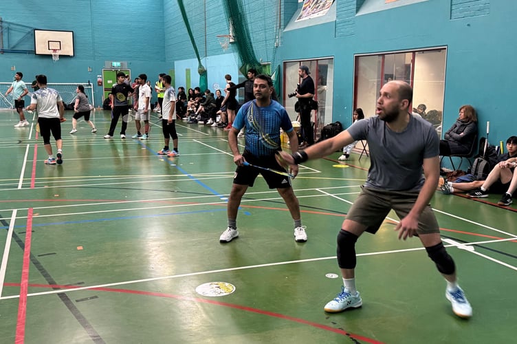 Many games in play at The United Smash Cup 2026.  AQ 4527
