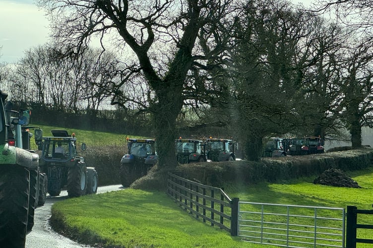 Tractors heading towards Raddon Top. AQ 5057