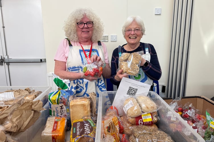 Crediton Food Larder stall, here with Gail Parsons and Alison Orchard where people could take away donated food items, rescued surplus food it had collected. AQ 5254
