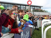 Young runners race down Exeter’s famous home straight on Family Day

