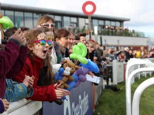 Young runners race down Exeter’s famous home straight on Family Day
