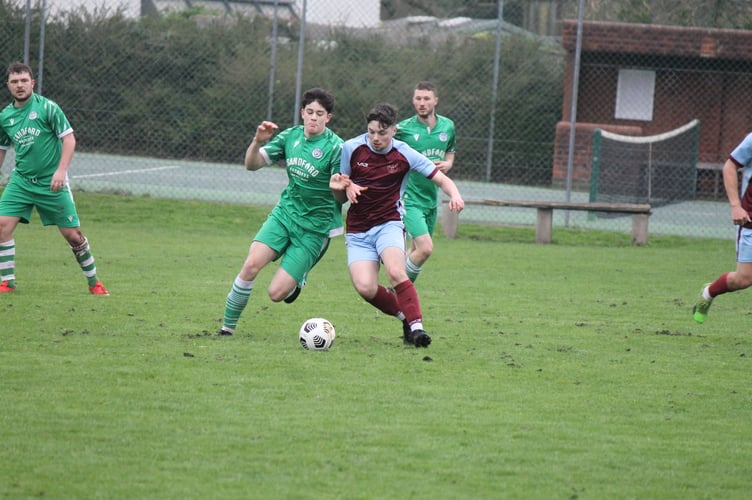 A real battle going on during the fast-paced Sandford v North Tawton game.  AQ 1064
