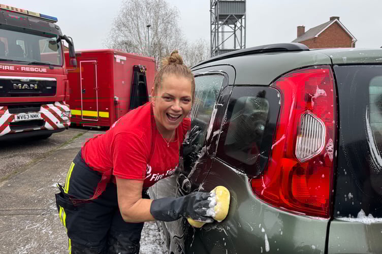Having a laugh while washing another car.  AQ 5843
