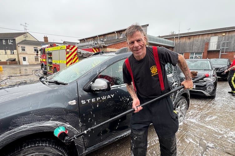 Former Crediton firefighter Reg Barker returned to volunteer at the fundraiser car wash.  AQ 5851
