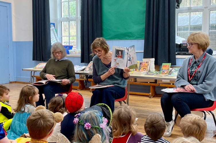The Bookery volunteers reading to children at Sandford School