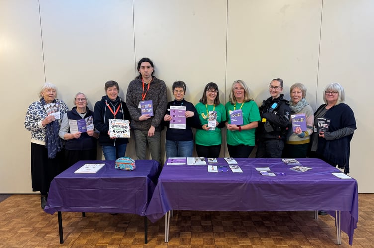 Eve Kingdom, fifth left, with helpers and some of the organisation representatives who attended an Epilepsy Awareness Day in Crediton.  AQ 3635
