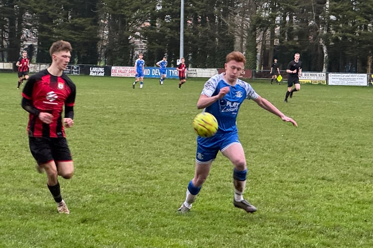 Crediton gained possession of the ball during this encounter.  AQ 5883
