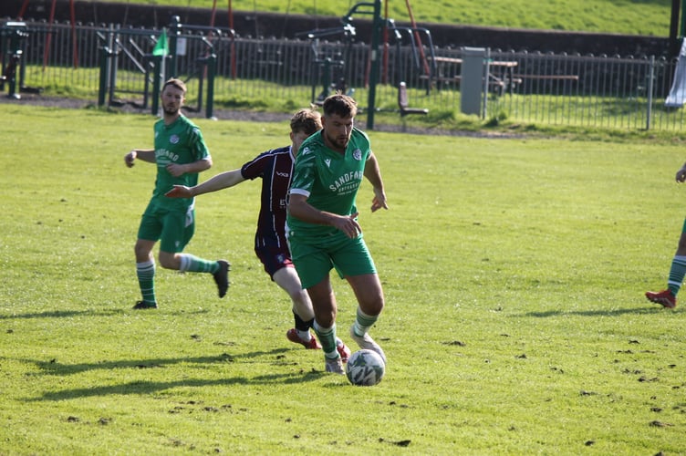 Sandford in possession during the game against Tedburn St Mary.  AQ 1120
