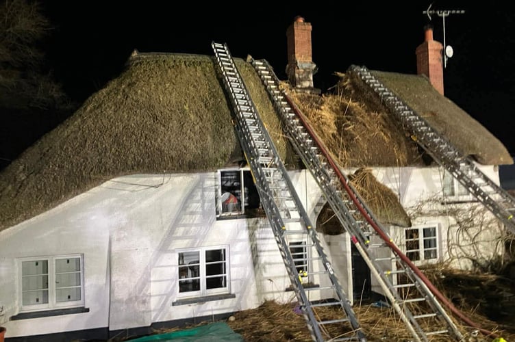 The scene after firefighters successfully stopped the fire by creating fire breaks next to the chimney of the thatched property near Colebrooke.