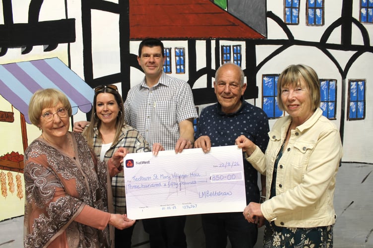 From left, Margaret Jones, chair, Tedburn St Mary Village Hall receives £350 from TADS Directors Sarah Drake and Andrew Smith, vice-chair Roger Sibley and chair Linda Bellshaw.  AQ 1162
