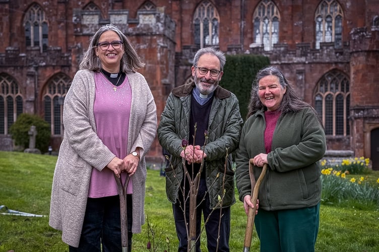 Crediton Team Vicar, Rev Janet May, Team Rector, Rev Matthew Tregenza and Licensed Lay Minister Antonia Tregenza who planted the magnolia tree in the churchyard at Crediton Parish Church.
