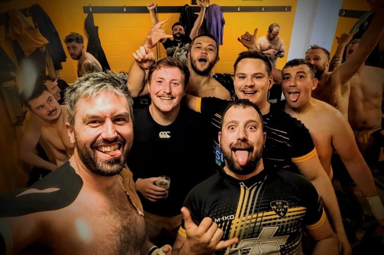 North Tawton celebrating their win over Newton Abbot Seconds in the changing rooms.
