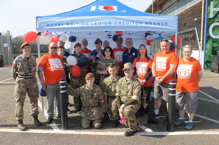 The Veterans in their special shirts, the cadets who helped run an awareness and fundraising stall and Ben from Crediton’s Tesco store before the event.  AQ 1159
