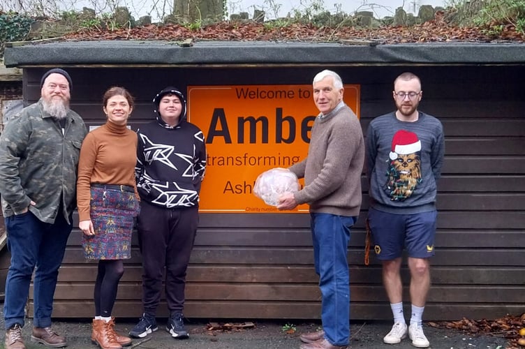 Sam Chandler, fourth left, of Crediton Boniface Rotary donating the 2025 Christmas turkey, which the club has done over the last few years.

