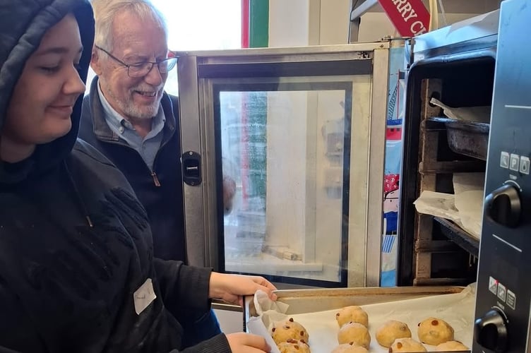 Fred Oliver of Crediton Boniface Rotary, teaches students baking at Amber, which he does on a regular basis.
