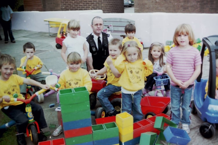 Children at Busy Bees pre-school at Copplestone learned about the police from Police Constable Mark Carnall in September 2005. DSC01386