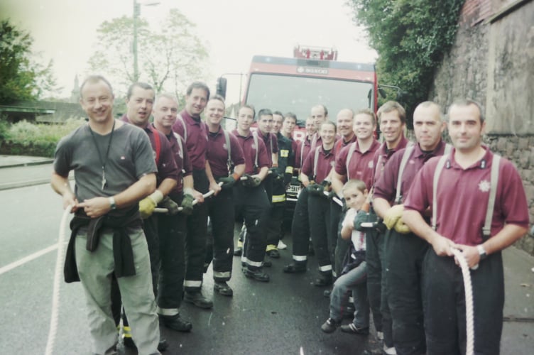 Crediton firefighters pulled a fire engine up Union Road in aid of charity in November 2005. DSC01912