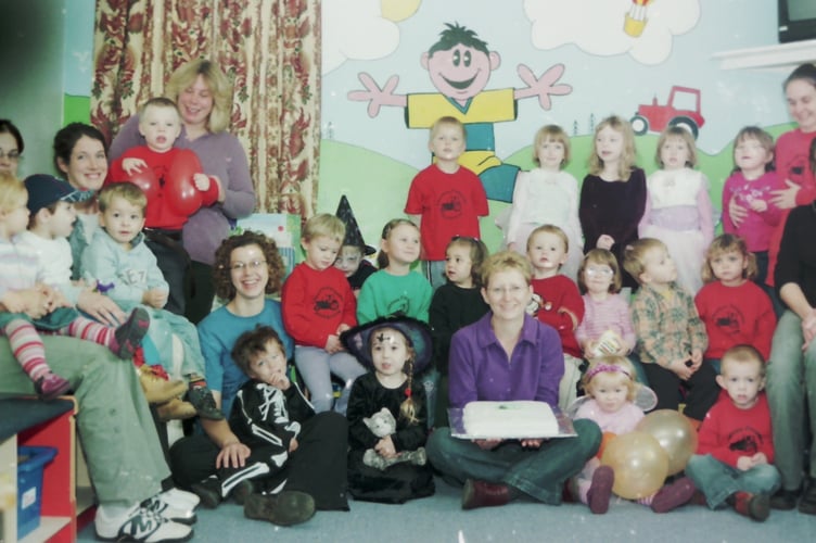 Cheriton Fitzpaine Playgroup were happy to be in new premises and celebrated with a cake in October 2005. DSC01685