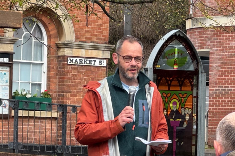Pastor James Gregory speaking in Crediton Town Square.  AQ 7641
