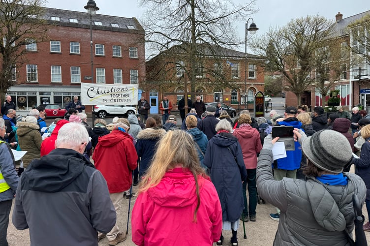 Worship taking place in Crediton Town Square during the Walk of Witness.  AQ 7617
